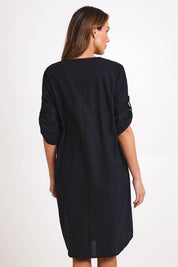 Model Madelinec wearing size 10 of the Invert Cotton Linen Blend Dress – Black in colour Black, from the back