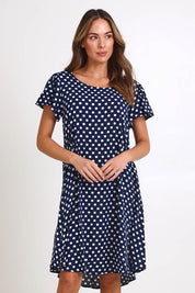 Model Madelinec wearing size 10 of the Flutter Swing Dress – Navywhite in colour Navywhite, in a cropped view