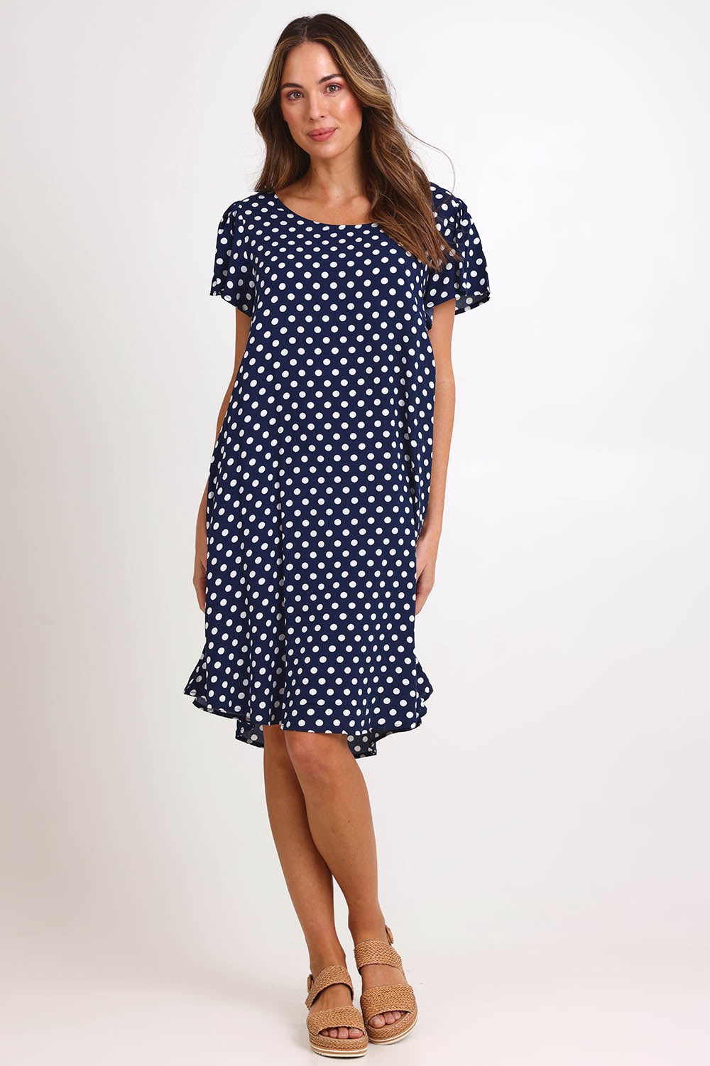 Model Madelinec wearing size 10 of the Flutter Swing Dress – Navywhite in colour Navywhite, from the front