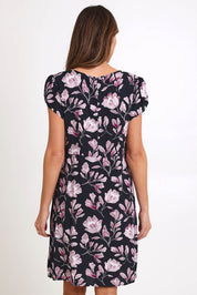 Model Madelinec wearing size 10 of the Kirra Pintuck Dress – Blkfloral in colour Blkfloral, from the back