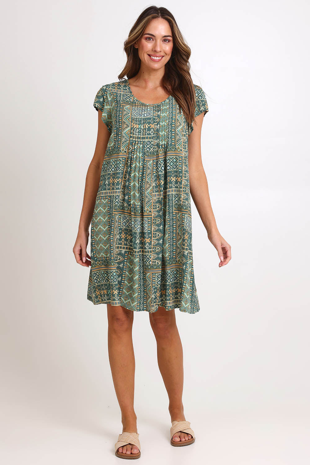 Model Madelinec wearing size 10 of the Kirra Pintuck Dress – Sage in colour Sage, from the front