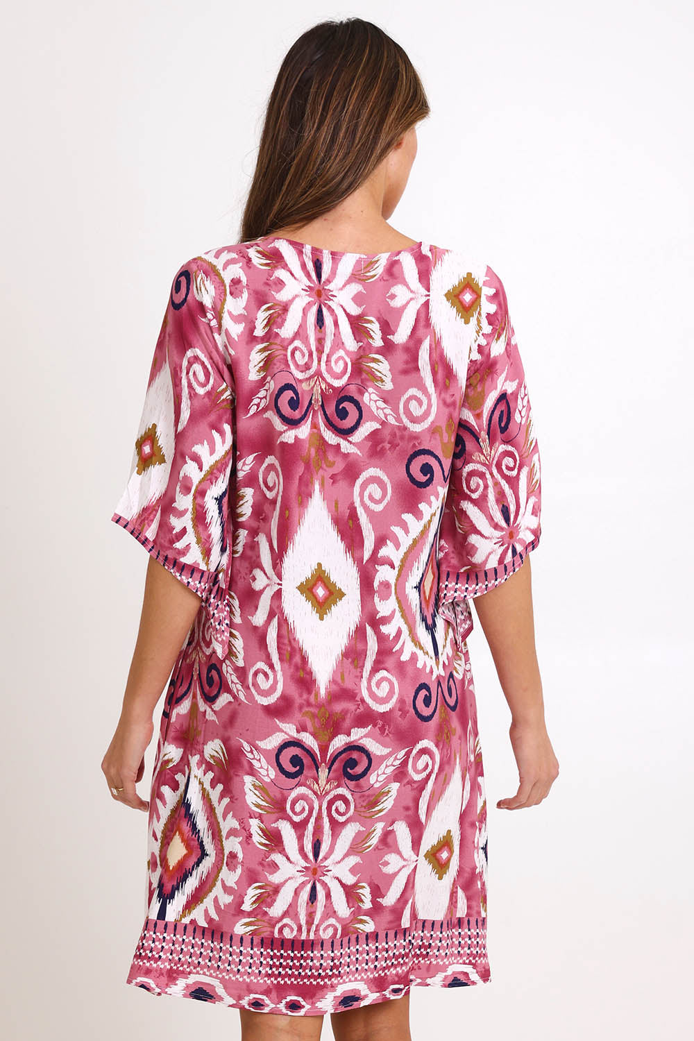Model Madelinec wearing size 10 of the Sun Dress – Rose in colour Rose, from the back