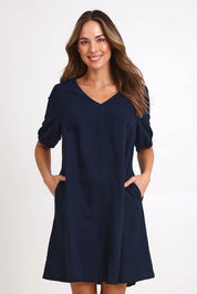 Model Madelinec wearing size 10 of the Core Linen V Shift Dress – Navy in colour Navy, in a cropped view