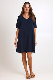 Model Madelinec wearing size 10 of the Core Linen V Shift Dress – Navy in colour Navy, from the front