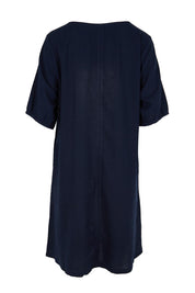 Product shot of the Core Linen V Shift Dress – Navy in colour Navy, from the back