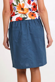 Model Madelinec wearing size 10 of the Linen Pocket Skirt – Ink in colour Ink, from the back