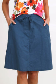 Model Madelinec wearing size 10 of the Linen Pocket Skirt – Ink in colour Ink, in a cropped view