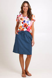 Model Madelinec wearing size 10 of the Linen Pocket Skirt – Ink in colour Ink, from the front