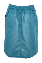 Product shot of the Linen Pocket Skirt – Ink in colour Ink, from the back