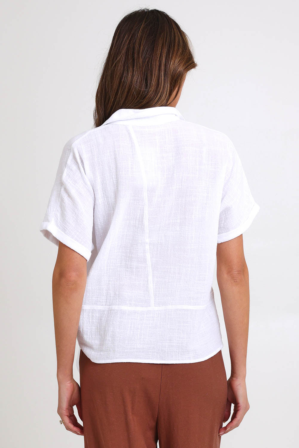 Model Madelinec wearing size 10 of the Core Wrap Over Top – White in colour White, from the back