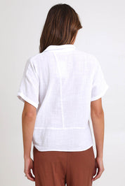 Model Madelinec wearing size 10 of the Core Wrap Over Top – White in colour White, from the back
