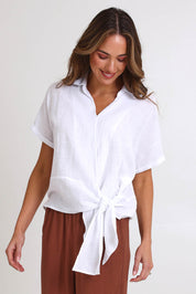 Model Madelinec wearing size 10 of the Core Wrap Over Top – White in colour White, in a cropped view