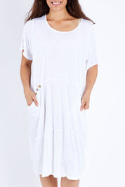 Model Larissa wearing size S-M of the Happy Petals Bounce Dress in colour White (White), from the front, cropped image