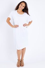 Model Larissa wearing size S-M of the Happy Petals Bounce Dress in colour White (White), from the front, showing the whole outfit