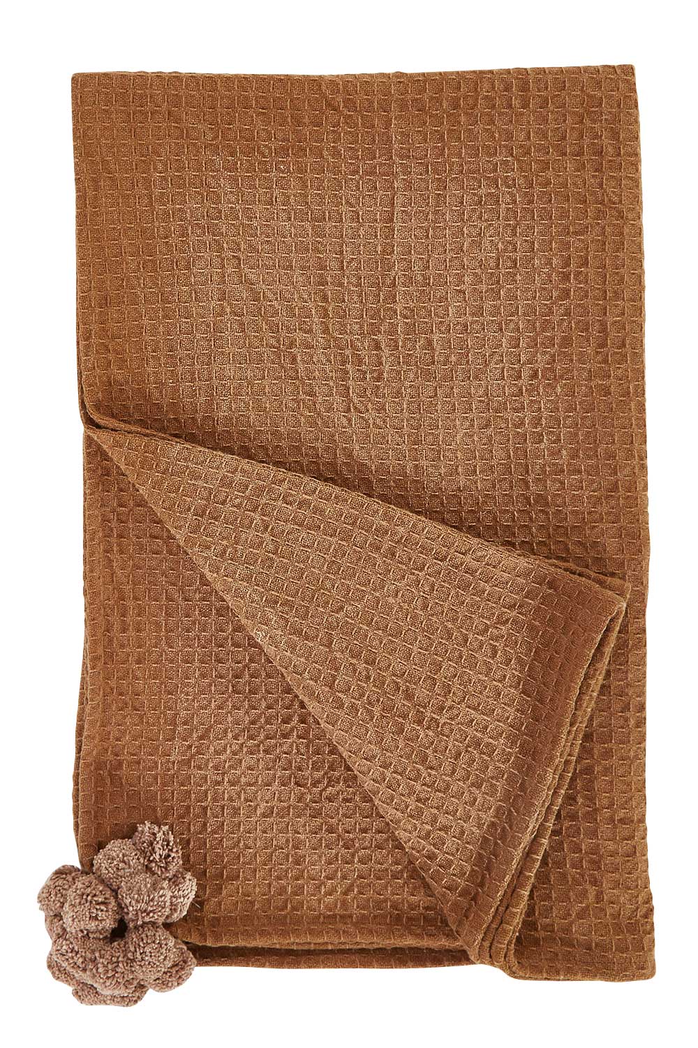 Product shot of the Textured Cotton Throw With Pompoms in colour Rust, from the front