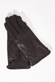 A model wearing size S of the Classic Leather Gloves in colour Black (Black), from the front, showing the whole outfit