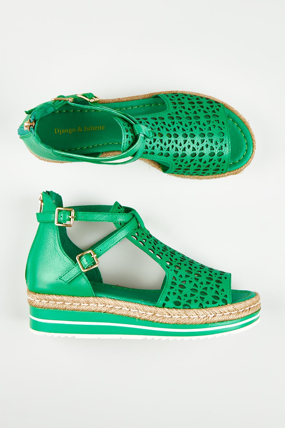 A model wearing size 37 of the Accra Leather Sandal in colour Emerald (Green), from the front, showing the whole outfit