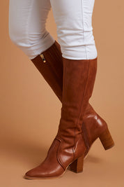 A model wearing size 38 of the Ammies Leather Boot in colour Cognac, from the front, showing the whole outfit