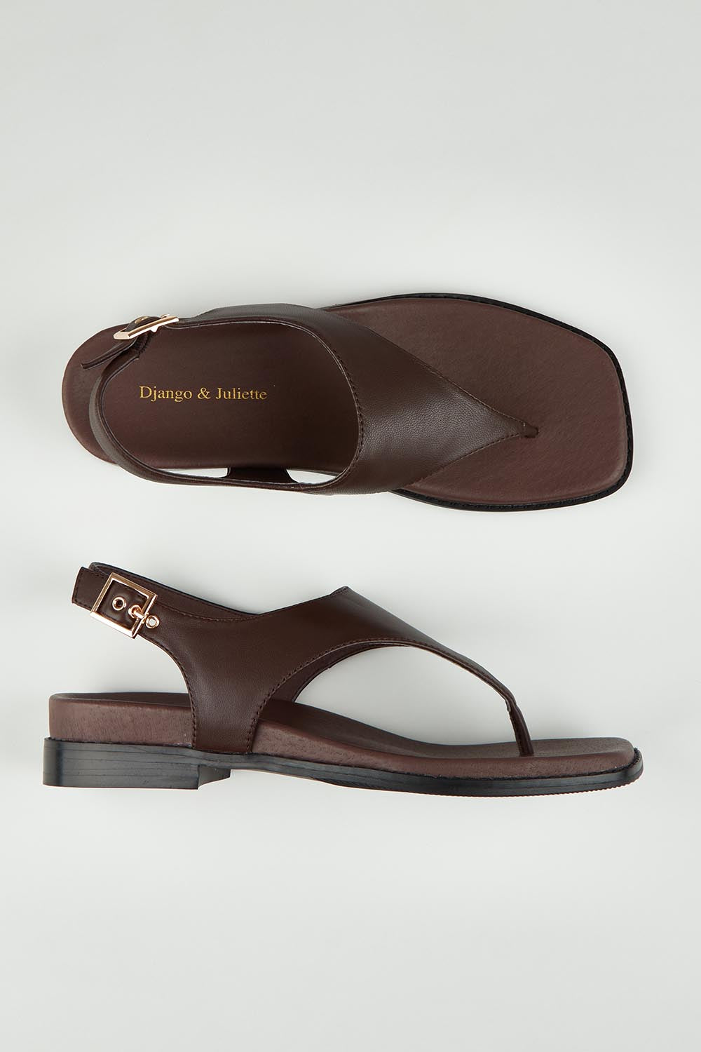 A model wearing size 37 of the Enyo Leather Flat in colour Chocolate, from the front, showing the whole outfit
