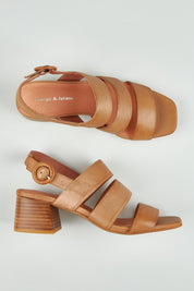 A model wearing size 37 of the Felicio Leather Heel in colour Cognac, from the front, showing the whole outfit