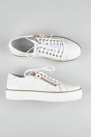 A model wearing size 36 of the Froggy Leather Sneaker in colour Whiteleath (White), from the front, showing the whole outfit