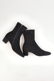 A model wearing size 37 of the Hartful Stretch Ankle Boot in colour Blackmicro (Black), from the front, showing the whole outfit