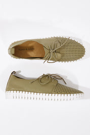 A model wearing size 37 of the Huston Leather Flat in colour Khaki (Green), from the front, showing the whole outfit