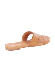 Product shot of the Jamel Leather Flat Sandal in colour Darktan, from the back