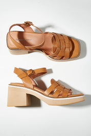 A model wearing size 37 of the Jelody Leather Heel in colour Tan, from the front, showing the whole outfit