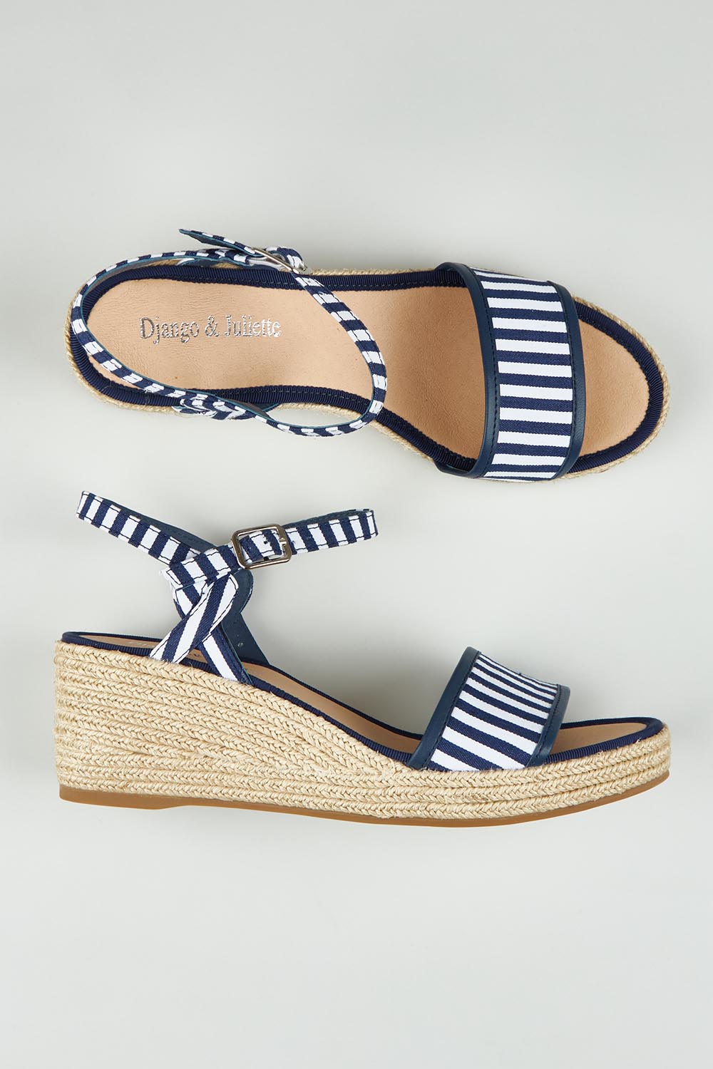 A model wearing size 37 of the Melodys Stripe Wedge in colour Navywhite (Blue), from the front, showing the whole outfit