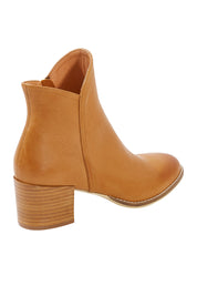 Product shot of the Mockas Ankle Boot in colour Dktan, from the back