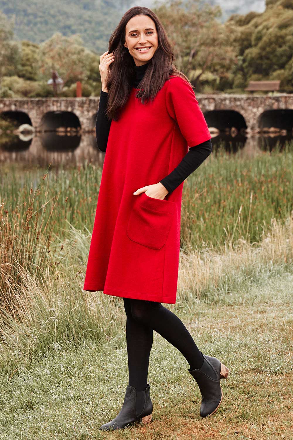 A model wearing size 38 of the Sadore Boot in colour Black (Black), from the front, showing the whole outfit