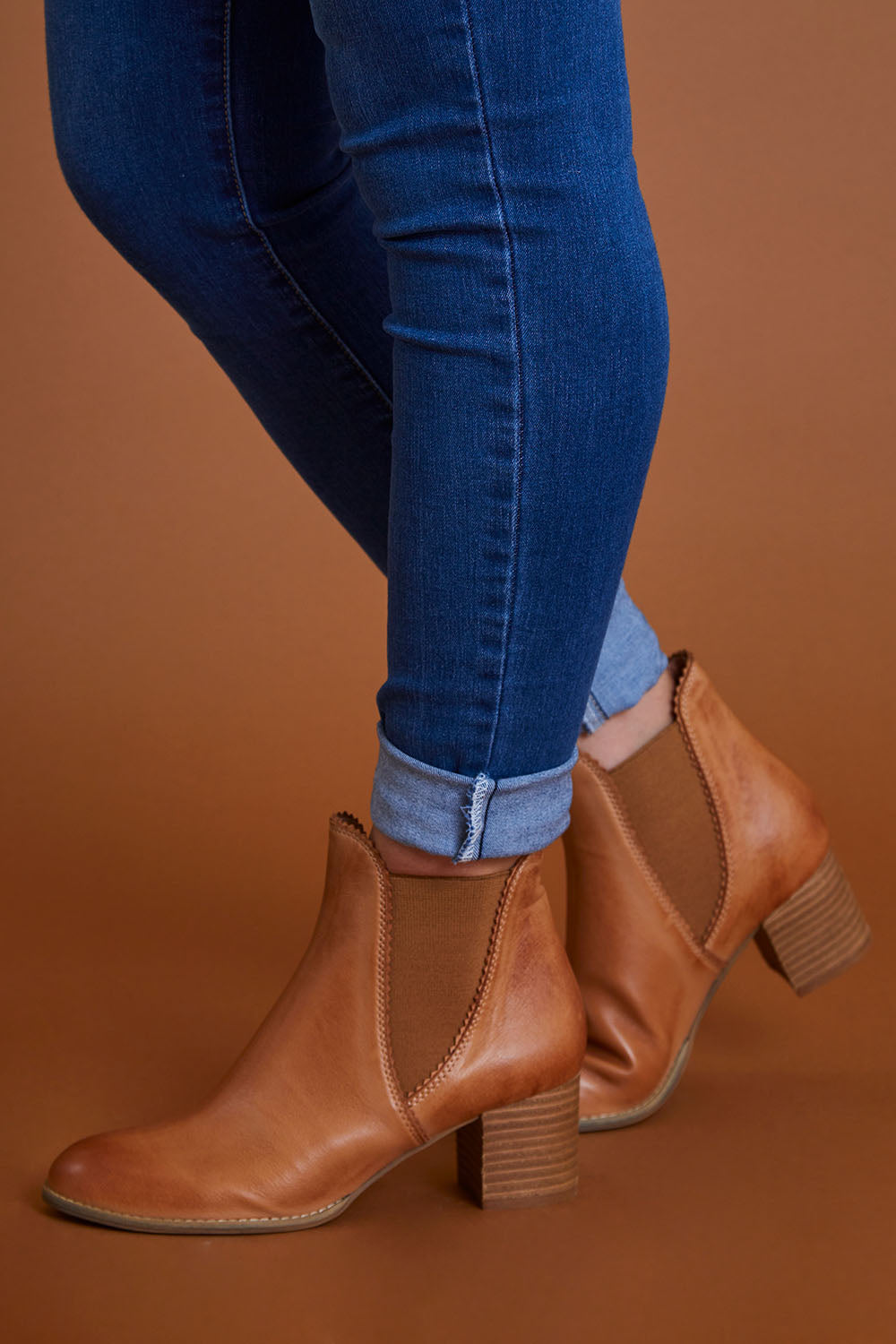 A model wearing size 40 of the Sadore Boot in colour TanLeath, from the front, cropped image