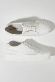 A model wearing size 36 of the Shia Leather Pull On Sneaker in colour Whitewhite (White), from the front, showing the whole outfit