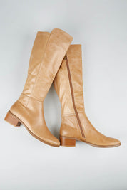 A model wearing size 36 of the Tetley Leather Calf Boot in colour Cappuccino, from the front, showing the whole outfit