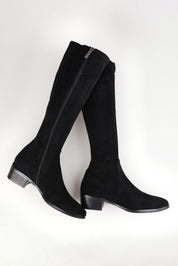 A model wearing size 37 of the Timothie Microsuede Calf Boot in colour Blacksuede (Black), from the front, showing the whole outfit