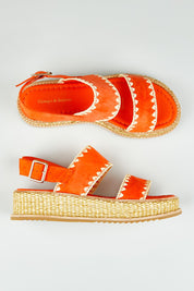 A model wearing size 37 of the Vera Suede Leather Flatform in colour Okorange, from the front, showing the whole outfit