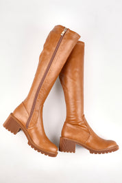 A model wearing size 37 of the Zina Stretch Knee Boot in colour Tansmooth, from the front, showing the whole outfit