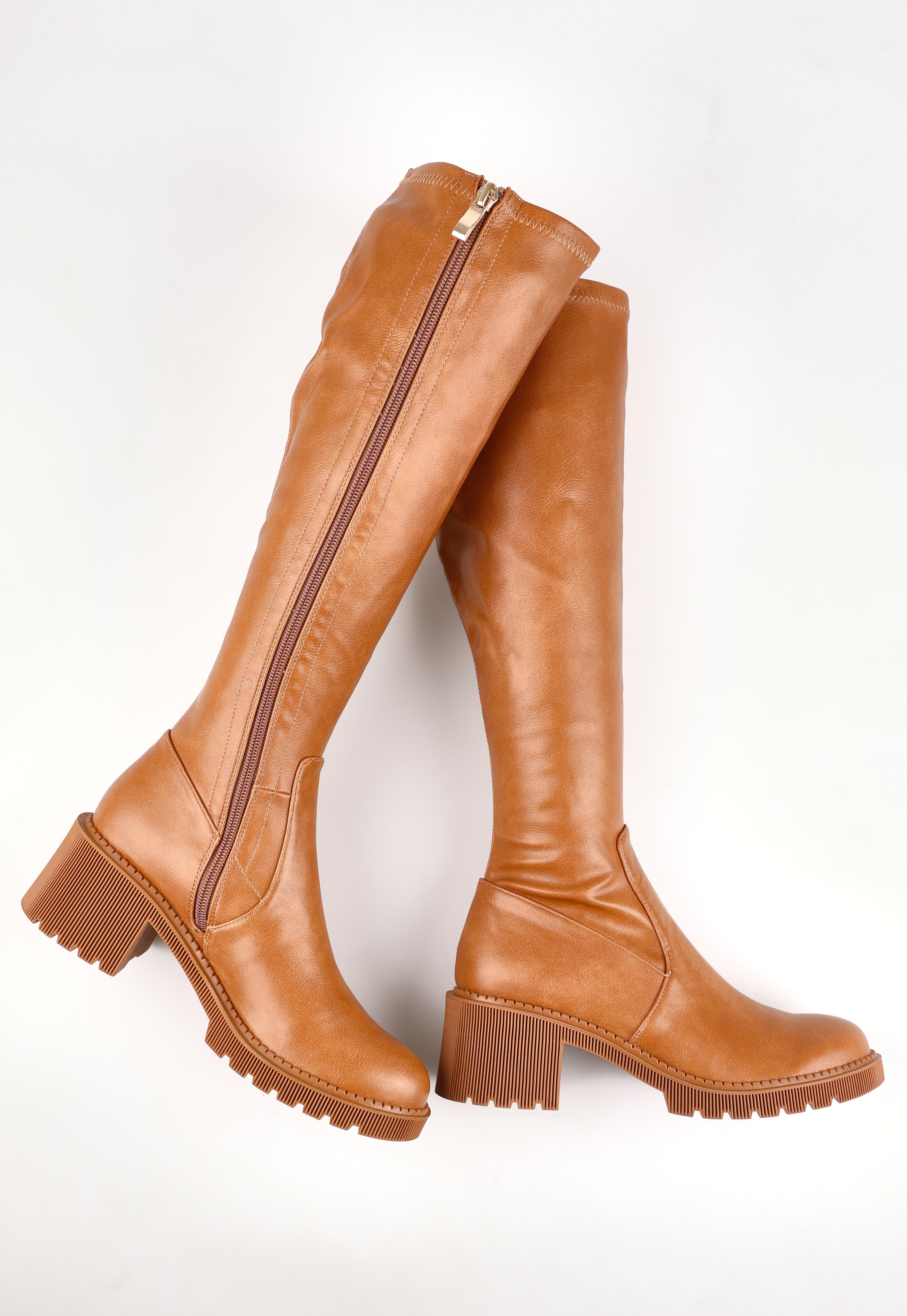 A model wearing size 37 of the Zina Stretch Knee Boot in colour Tansmooth, from the front, showing the whole outfit
