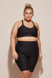A model wearing the Elite Bike Pant in colour Black (Black), from the front, cropped image