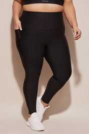 A model wearing the Elite Tight Full Length in colour Black (Black), from the front, cropped image