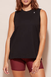 A model wearing the Champion Tank in colour Black (Black), from the front, cropped image