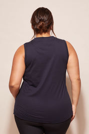 A model wearing the Champion Tank in colour Navy (Blue), from the back