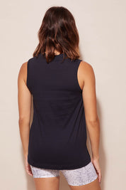 A model wearing the Champion Tank in colour Navy (Blue), from the back