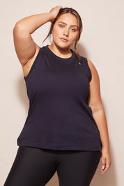 A model wearing the Champion Tank in colour Navy (Blue), from the front, cropped image