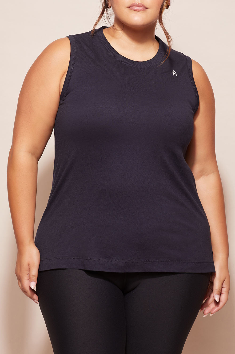 A model wearing the Champion Tank in colour Navy (Blue), from the front, cropped image