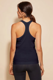 A model wearing the Tempo Tank in colour Navy (Blue), from the back
