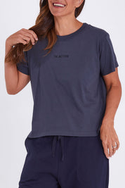 Model Alex wearing the Way Back Tee in colour Smoke (Grey), from the front, cropped image