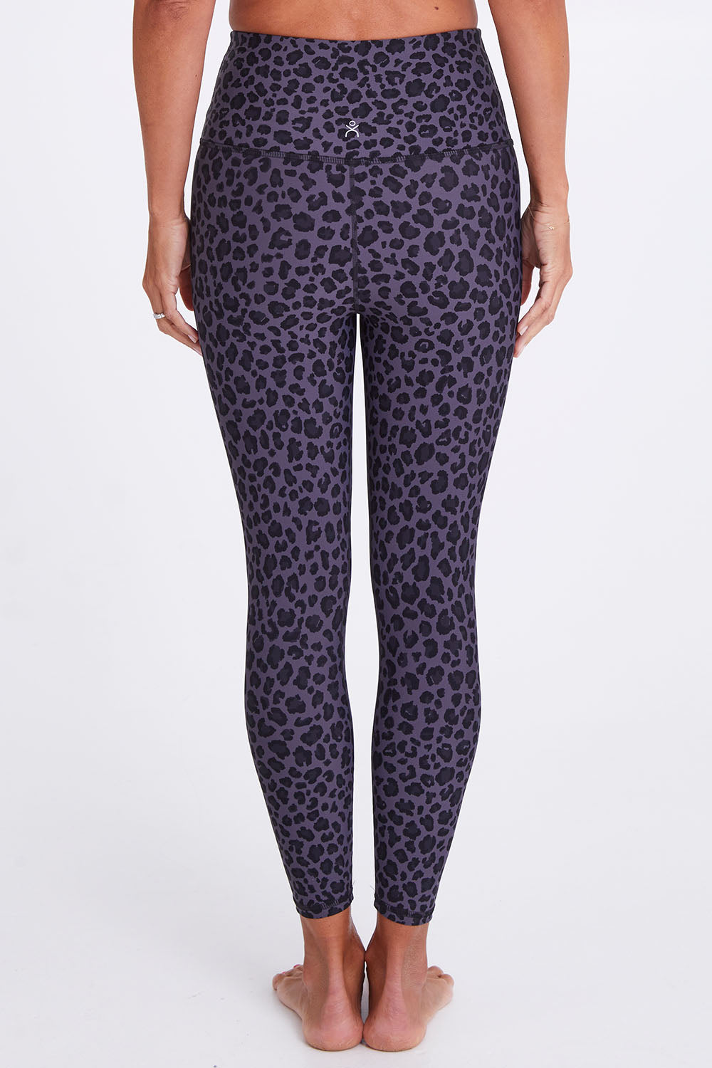Model Alex wearing the Utopia Tight in colour Leopardsmk (Grey), from the back