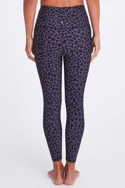 Model Alex wearing the Utopia Tight in colour Leopardsmk (Grey), from the back